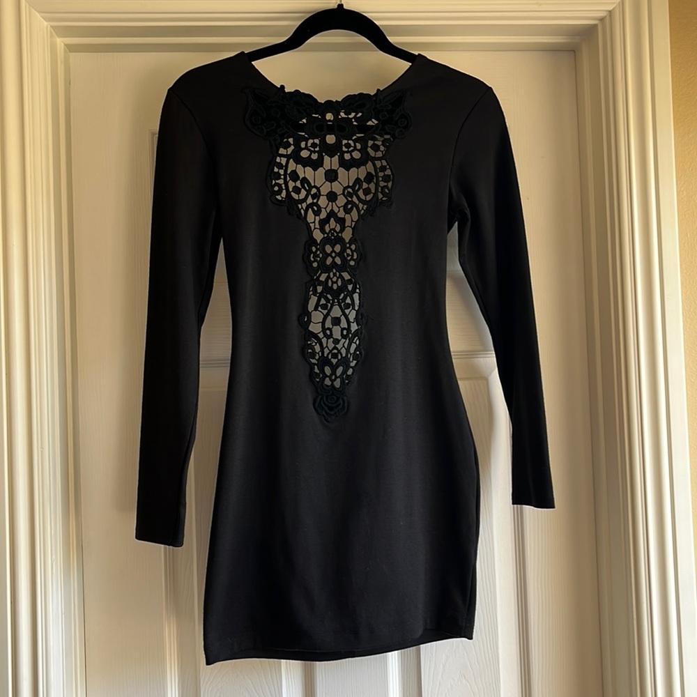 Black dress made w poly, rayon, spandex